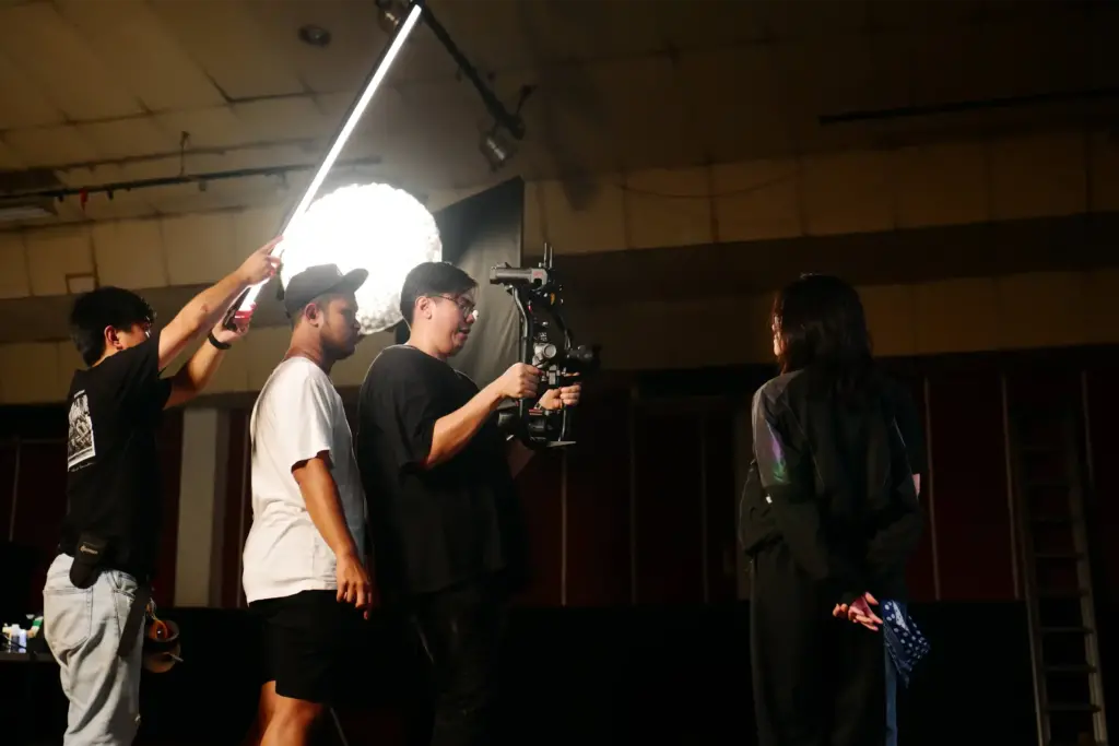 Director of photography testing his camera at a production house shoot.
