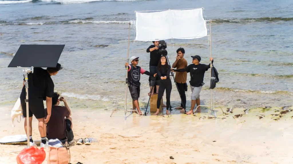 Director guiding on-camera interview under natural light during ASUS ESG video shoot.