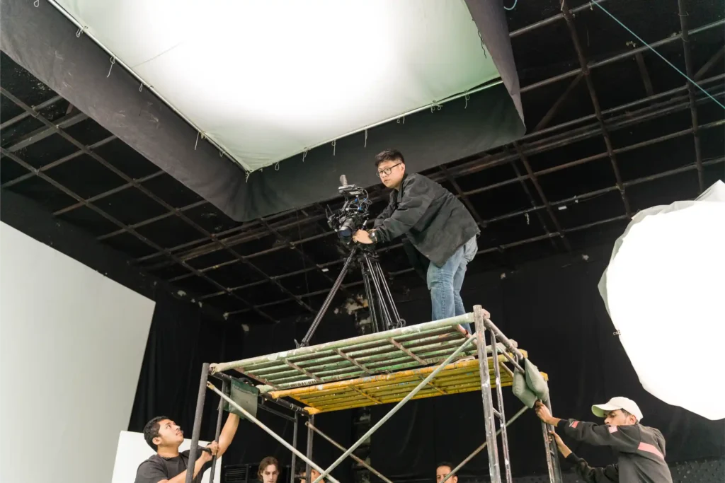 camera man operating a cinema camera in a production set