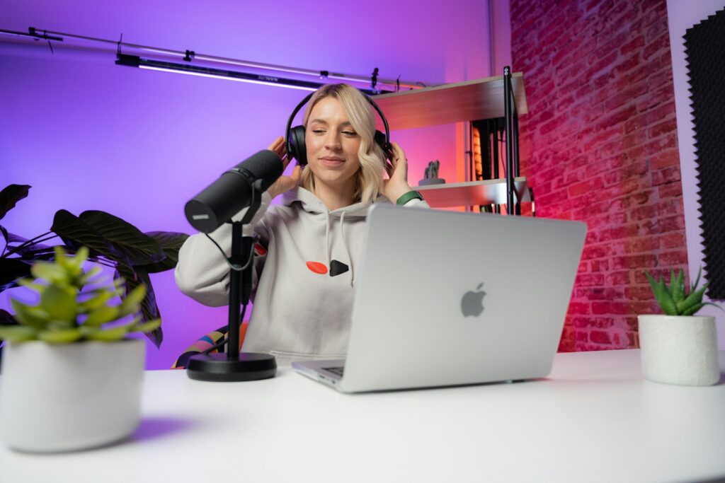 video content marketing creator sitting in front of a laptop.