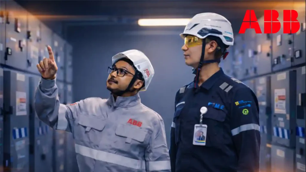 ABB engineers inspecting electrical equipment inside an industrial control room during a corporate video shoot