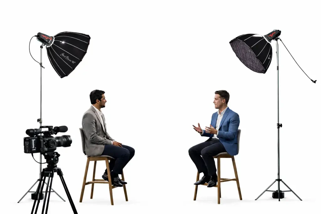 Professional corporate interview production by SNXP Studio, featuring a clean white-background setup with cinema lighting and professional cameras for polished, high-trust business videos.